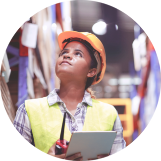Supply Chain worker wears hardhat and looks up while checking list